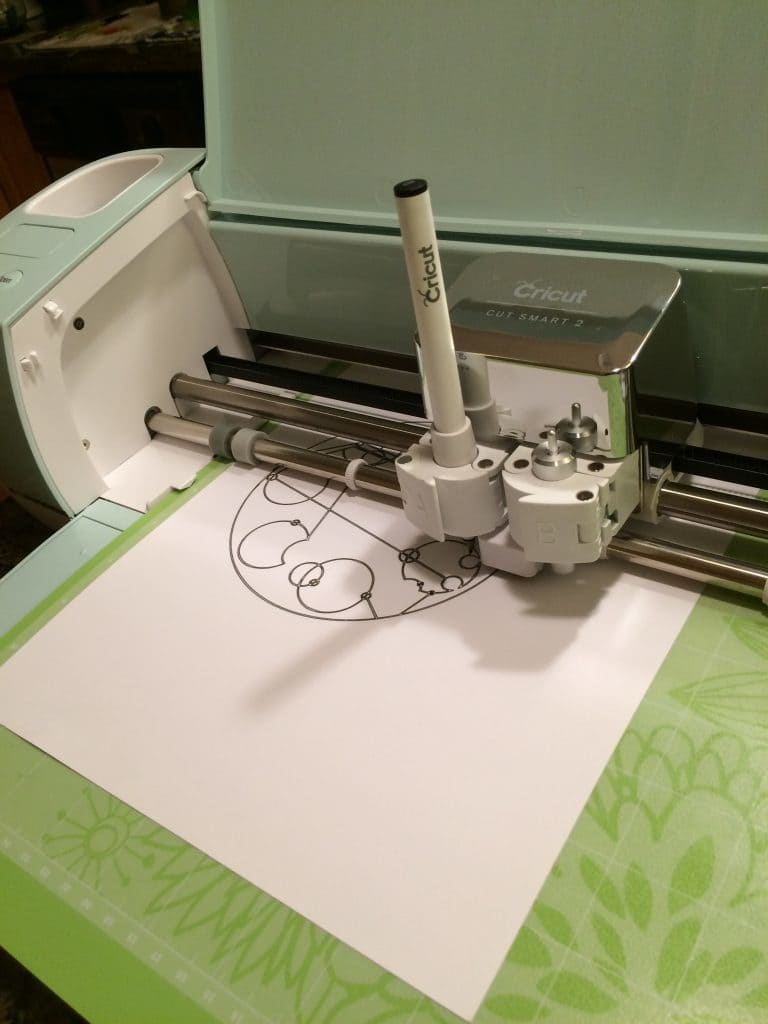 You can put a pen into the Cricut Explore Air 2 for writing